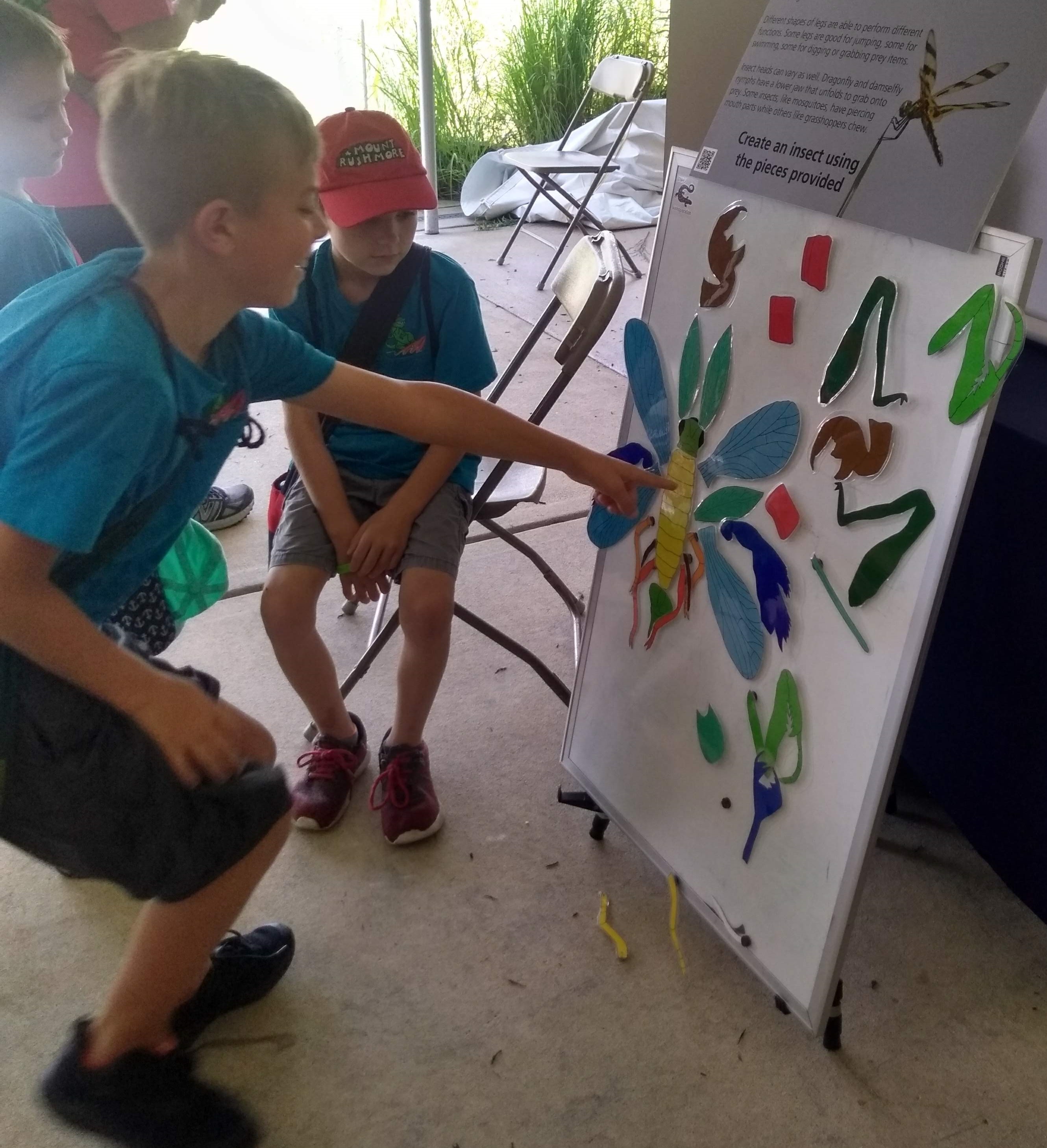 Adorable child creates insect